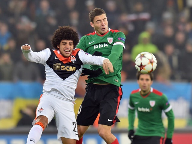 FC Shakhtar's Donetsk Taison and Oscar de Marcos Athletic Bilbao vie during their UEFA Champions League Group H football match FC Shakhtar vs Athletic in Lviv on November 25, 2014