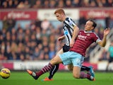 West Ham United's English midfielder Mark Noble vies with Newcastle United's English midfielder Jack Colback during the English Premier League football match between West Ham United and Newcastle United at the Boleyn Ground, Upton Park, in east London on 
