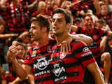 Brendan Hamill and Tomi Juric of the Wanderers celebrate a goal by Juric during the round eight A-League match between Western Sydney Wanderers and Sydney FC at Pirtek Stadium on November 29, 2014