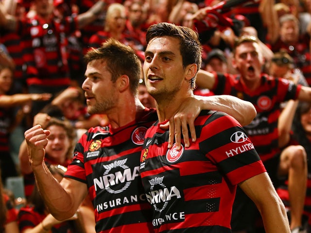 Brendan Hamill and Tomi Juric of the Wanderers celebrate a goal by Juric during the round eight A-League match between Western Sydney Wanderers and Sydney FC at Pirtek Stadium on November 29, 2014