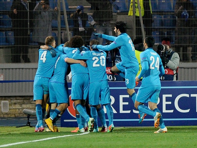 Zenit's players celebrate their goal during the UEFA Champions league group C football match against Benfica in St. Petersburg on November 26, 2014