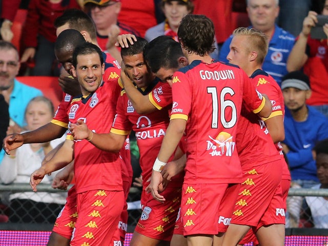 Fabio Ferreira (#22) of Adelaide United is congratulated by teammates after scoring a goal during the round 10 A-League match between Adelaide United and the Western Sydney Wanderers at Coopers Stadium on December 6, 2014