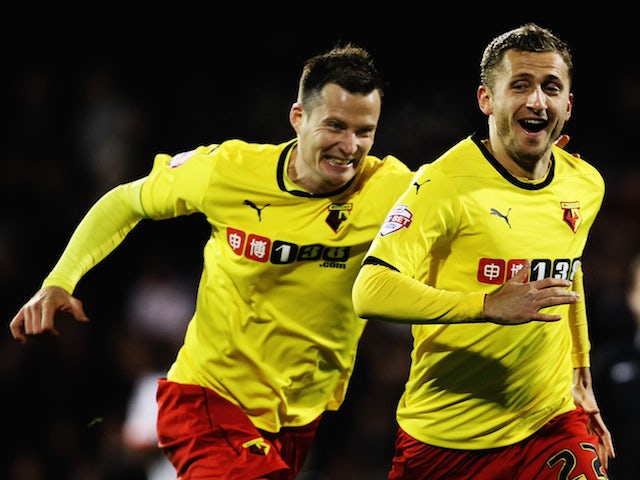 Almen Abdi (right) of Watford celebrates with team mates after scoring his sides fourth goal during the Sky Bet Championship match against Fulham on December 5, 2014