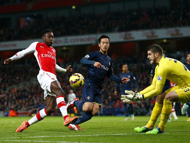 Danny Welbeck of Arsenal attempts to score in front of Fraser Forster of Southampton during the Barclays Premier League match between Arsenal and Southampton at Emirates Stadium on December 3, 2014