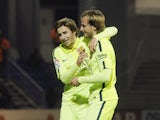 Barcelona's Croatian midfielder Ivan Rakitic celebrates with his teammate midfielder Sergi Samper after scoring during the Spanish Copa del Rey (King's Cup) round of 32 first leg football match S.A.D. Huesca vs FC Barcelona at El Alcoraz stadium in Huesca