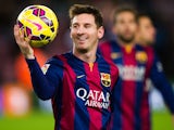 Lionel Messi of FC Barcelona with the match ball after scoring three goals during the La Liga match between FC Barcelona and RCD Espanyol at Camp Nou on December 7, 2014