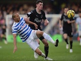 Bobby Zamora of QPR is challenged by Michael Keane of Burnley during the Barclays Premier League match on December 6, 2014