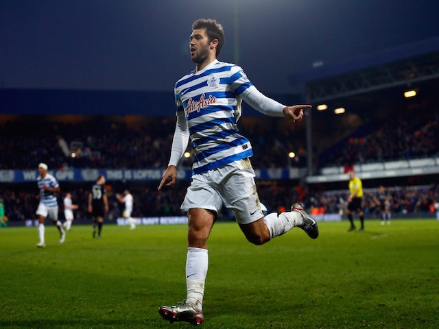 Charlie Austin of QPR celebrates scoring his team's second goal during the Barclays Premier League match against Burnley on December 6, 2014
