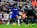 Jack Colback of Newcastle challenges Willian of Chelsea during the Barclays Premier League match between Newcastle United and Chelsea at St James' Park on December 6, 2014