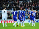 Despondent Chelsea players look on as their unbeaten record in 2014-15 ends against Newcastle United in the Premier League on December 6, 2014