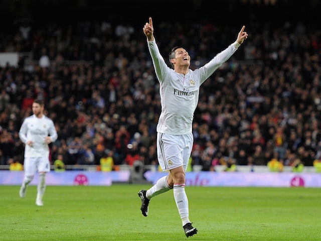 Cristiano Ronaldo of Real Madrid celebrates after scoring Real's 2nd goal during the La Liga match against Celta Vigo on December 6, 2014