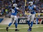 Joique Bell #35 and Calvin Johnson #81 of the Detroit Lions celebrate a second quarter touchdown while playing the Tampa Bay Buccaneers at Ford Field on December 07, 2014