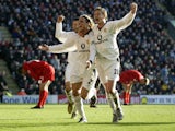 Diego Forlan of Manchester United celebrates scoring the second goal of the match with team-mates Ryan Giggs and Ole Gunnar Solskjaer during the FA Barclaycard Premiership match between Liverpool and Manchester United held on December 1, 2002