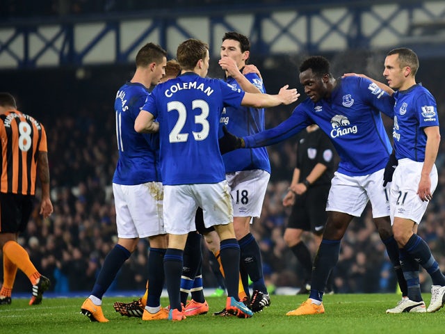 Everton's Belgian striker Romelu Lukaku celebrates scoring the opening goal with Everton players during the English Premier League football match between Everton and Hull City at Goodison Park in Liverpool on December 3, 2014