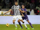 Stefan Savic of ACF Fiorentina fights for the ball with Fernando Llorente of Juventus FC during the Serie A match on December 5, 2014