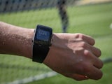 A man tries the special watch for the goal-line technology (GLT) to be used in the FIFA World Cup for the first time --to give more accuracy to referees-- at Maracana Stadium on December 5, 2014