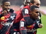 Guingamp's French midfielder Claudio Beauvue celebrates with teammates after scoring the ball during the French L1 football match EA Guingamp vs Stade Malherbe Caen on December 3, 2014