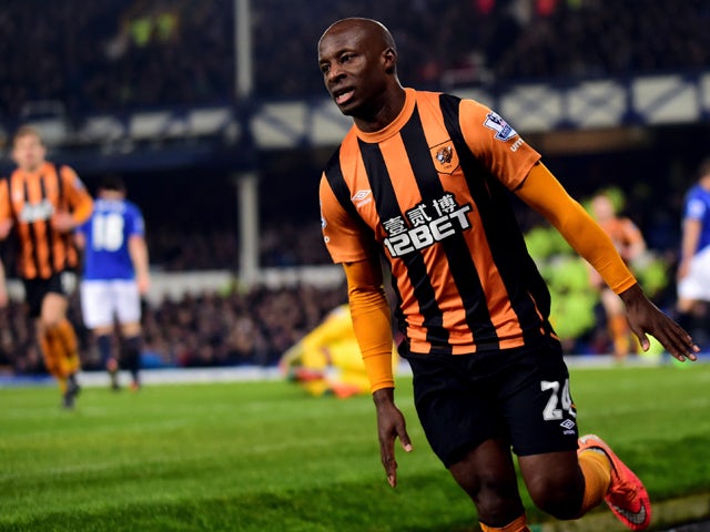 Hull City's Nigerian midfielder Sone Aluko celebrates scoring their first goal during the English Premier League football match between Everton and Hull City at Goodison Park in Liverpool, north west England on December 3, 2014