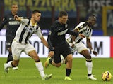 Mateo Kovacic of FC Internazionale Milano competes for the ball with Bruno Borges Fernandes and Babu Emmanuel Agyemang (R) of Udinese Calcio during the Serie A match between FC Internazionale Milano and Udinese Calcio at Stadio Giuseppe Meazza on December