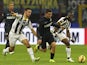Mateo Kovacic of FC Internazionale Milano competes for the ball with Bruno Borges Fernandes and Babu Emmanuel Agyemang (R) of Udinese Calcio during the Serie A match between FC Internazionale Milano and Udinese Calcio at Stadio Giuseppe Meazza on December