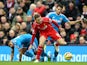 Jordan Henderson of Liverpool battles for the ball with Jordi Gomez and Liam Bridcutt of Sunderland during the Barclays Premier League match on December 6, 2014