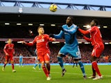 Jozy Altidore of Sunderland battles for the ball with Kolo Toure and Alberto Moreno of Liverpool during the Barclays Premier League match on December 6, 2014
