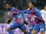 Caen's French forward Lenny Nangis (L) celebrates with a teammate after scoring a goal during the French L1 football match against Nice on December 6, 2014