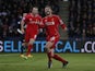 Liverpool's English midfielder Adam Lallana celebrates scoring their first goal as Liverpool's English striker Rickie Lambert reacts behind during the English Premier League football match between Leicester City and Liverpool at King Power Stadium in Leic