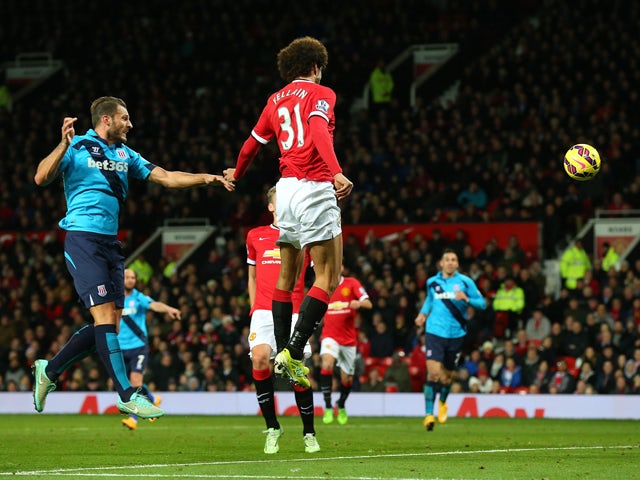 Marouane Fellaini of Manchester United scores the first goal during the Barclays Premier League match between Manchester United and Stoke City at Old Trafford on December 2, 2014