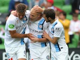 Aaron Mooy of City is congratulated by team mates after scoring a goal during the round 10 A-League match between Melbourne City FC and Brisbane Roar at AAMI Park on December 7, 2014
