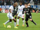 Metz's forward Federico Andrada vies with Marseille's French defender Rod Fanni during the French L1 football match between Marseille and Metz at the Velodrome stadium in Marseille on December 7, 2014