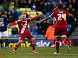 Adam Clayton of Middlesbrough celebrates after Jelle Vossen scores to make it 4-0 during the Sky Bet Championship match between Millwall and Middlesbrough at The Den on December 6, 2014 