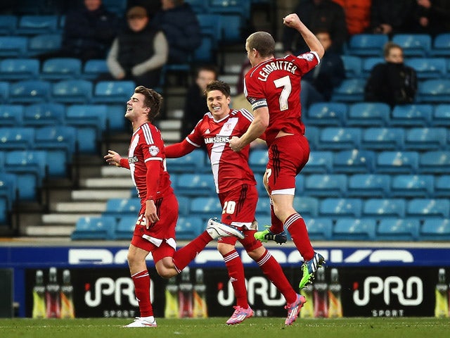 Middlesbrough celebrate with Patrick Bamford after he scores to make it 2-0 during the Sky Bet Championship match between Millwall and Middlesbrough at The Den on December 6, 2014