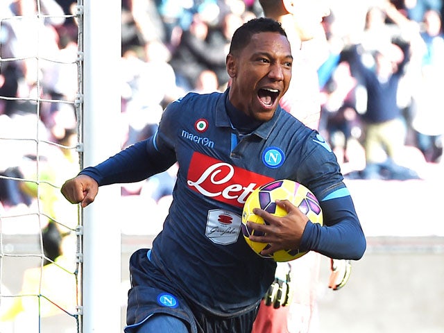 Jonathan De Guzman of Napoli celebrates after scoring the goal 2-2 during the Serie A match between SSC Napoli and Empoli FC at Stadio San Paolo on December 7, 2014