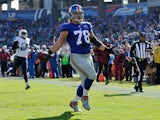 Markus Kuhn #78 of the New York Giants carries a fumble into the end zone for a touchdown against the Tennessee Titans during the first quarter in a game at LP Field on December 7, 2014