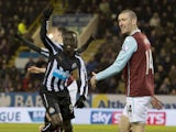 Newcastle United's Senegalese striker Papiss Cisse celebrates scoring their first goal during the English Premier League football match between Burnley and Newcastle United at Turf Moor in Burnley, north west England, on December 2, 2014
