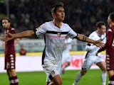 Paulo Dybala of Palermo celebrates after scoring his team's second goal during the Serie A match against Torino on December 6, 2014