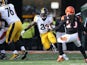 Le'Veon Bell #26 of the Pittsburgh Steelers attempts to run past Reggie Nelson #20 of the Cincinnati Bengals during the first quarter at Paul Brown Stadium on December 7, 2014