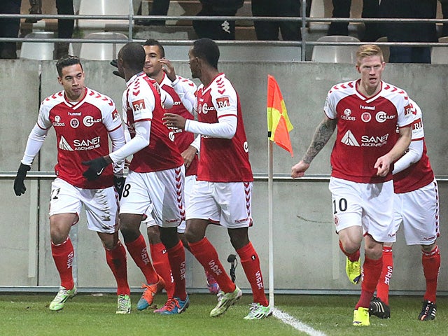 Reims' players celebrates after French forward Gaetan Charbonnier scored a goal during the French L1 football match Stade de Reims vs Guingamp at Auguste Delaune Stadium in Reims on December 7, 2014
