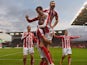  Jon Walters of Stoke is mobed by Phil Bardsley and Peter Crouch after scoring to make it 3-0 during the Barclays Premier League match between Stoke City and Arsenal at Britannia Stadium on December 6, 2014