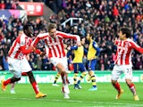 Peter Crouch of Stoke City celebrates scoring the opening goal during the Barclays Premier League match between Stoke City and Arsenal at the Britannia Stadium on December 6, 2014 