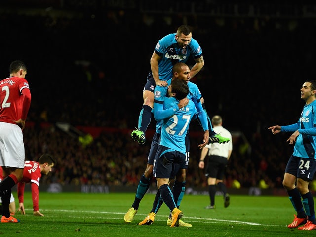 Steven Nzonzi of Stoke City celebrates scoring his team's first goal with his team-mates during the Barclays Premier League match between Manchester United and Stoke City at Old Trafford on December 2, 2014