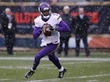 Teddy Bridgewater #5 of the Minnesota Vikings rolls out during the first half of a game against the Chicago Bears at Soldier Field on November 16, 2014