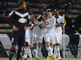 Lorient's French defender Vincent Le Goff (C) celebrates with teammates after scoring a goal during the French L1 football match between Bordeaux (FCGB) and Lorient (FCL) on December 6, 2014 