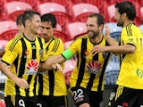 Wellington Pheonix team mates celebrate a goal during the round 10 A-League match between the Newcastle Jets and the Wellington Phoenix at Hunter Stadium on December 6, 2014