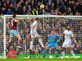 West Ham United's English striker Andy Carroll scores West Ham's first goal to equalise during the English Premier League football match between West Ham United and Swansea City at the Boleyn Ground, Upton Park, in east London on December 7, 2014