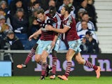 Kevin Nolan of West Ham United (L) celebrates with team mates Cheikhou Kouyate and Andy Carroll of West Ham United as he scores their first and equalising goal during the Barclays Premier League match between West Bromwich Albion and West Ham United at Th