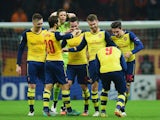 Aaron Ramsey of Arsenal (3R) celebrates with team mates as he scores their third goal during the UEFA Champions League Group D match against Galatasaray on December 9, 2014
