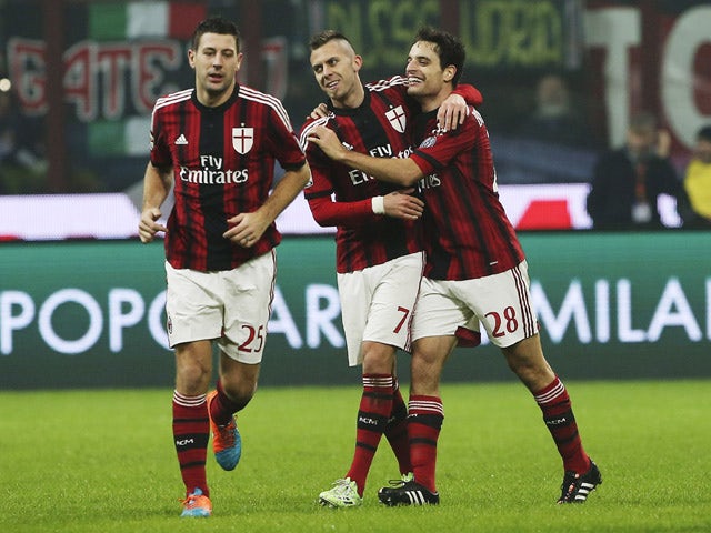 Giacomo Bonaventura of AC Milan celebrates his goal with his team-mate Jeremy Menez during the Serie A match between AC Milan and SSC Napoli at Stadio Giuseppe Meazza on December 14, 2014