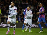 Lyon forward Alexandre Lacazette (L) celebrates with his teamates after scoring a penalty against Caen on December 12, 2014